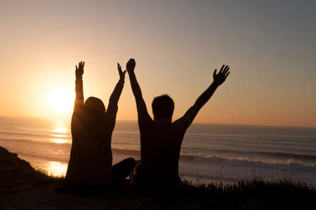 couple watching sunsetの写真素材