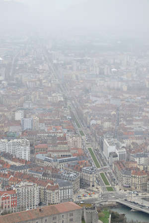 Birds eye view of city of Grenoble, France, on a cold snowy winter dayの写真素材