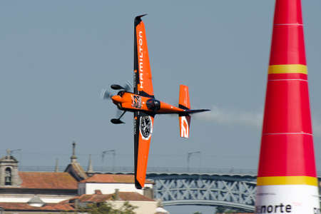 Red Bull Air Race 2017 Porto - Nicolas Ivanoff plane flying vertical pass pylonのeditorial素材