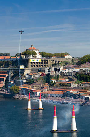 Red Bull Air Race 2017 Porto - Pete McLeod flying panorama against city and audience backgroundのeditorial素材