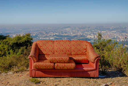 Bold colorful pattern fabric sofa outdoor, overlooking Porto metropolitan area in Portugalの写真素材