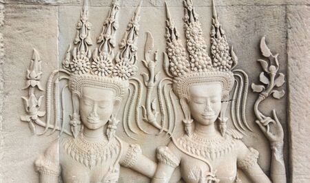 Dancer carving in the wall in Angkor Wat, Cambodia. Ancient khmer architectureの写真素材