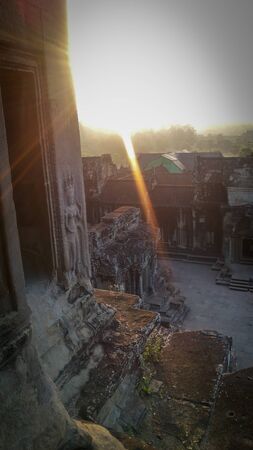 Sun rays blessing the angkor wat temple in Cambodia. Very inspiring and clean imageの写真素材