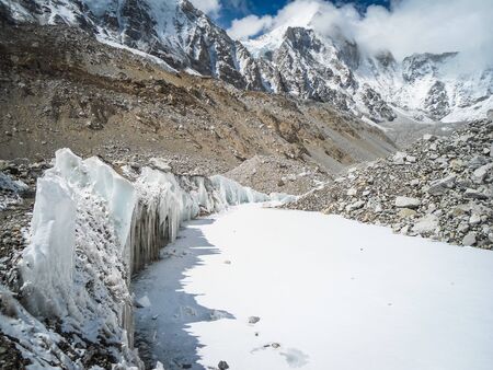 Ice stalactite in Nepal. Beautiful rock cave and pathway in the Everest base camp Trekの写真素材