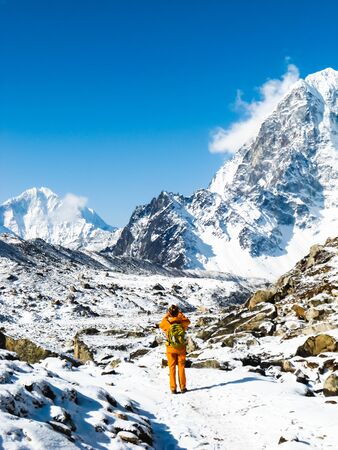 Lonely trekker taking pictures in Everest base camp trekの写真素材