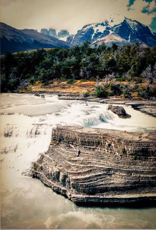 Beautiful and pristine river at Torres del Paine, Chile. Waterfall and rocksの写真素材