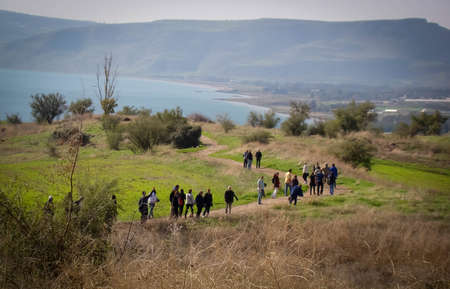 tourists in the mount of the beatitudes at the sea of Galilee, Israel. Sunset view