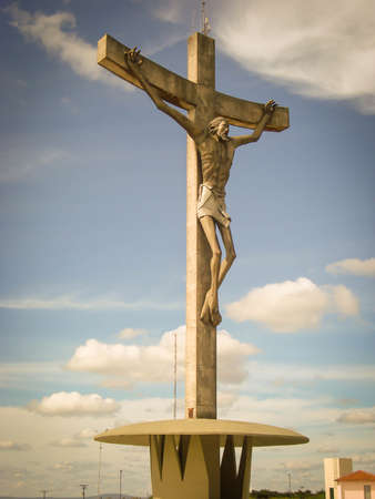 Amazing Jesus Christ at the cross in Vitoria da Conquista, Bahia, Brazil. Famous touristic place at the top of the hill. Sculpture by Mario Cravo called Cristo sertanejoの写真素材
