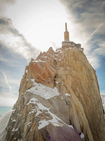 Aguille du Midi , 3.842m hig in the Mont Blanc massif of the french Alps in France. Very famous place to visit in the Apls. Cable car and skiersの写真素材
