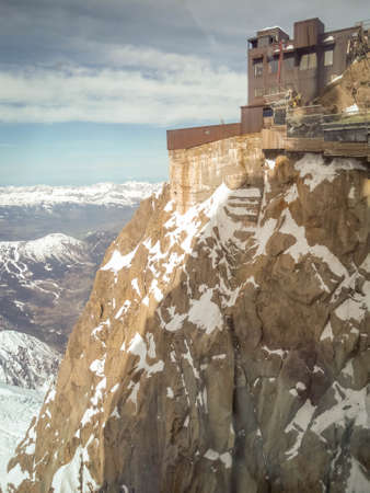 Aguille du Midi , 3.842m hig in the Mont Blanc massif of the french Alps in France. Very famous place to visit in the Apls. Cable car and skiersのeditorial素材