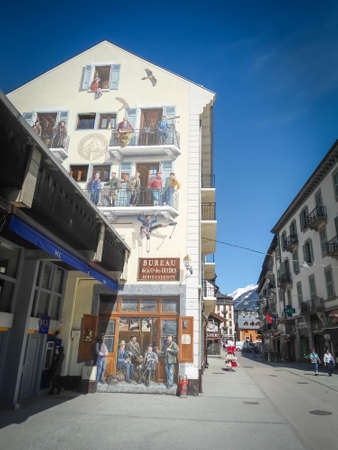 Beautiful painted false facade in Chamonix, France, with ancient tour guides painted. Art in the wallのeditorial素材