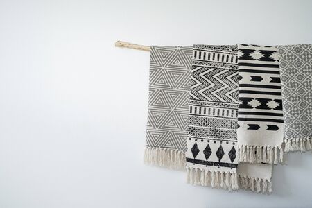 Stylish carpets hanging on a wooden stickの写真素材