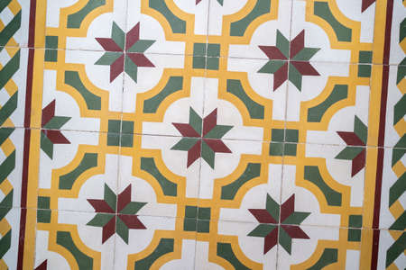 Retro old vintage floor tiles. Portuguese House Marocain style interior hydraulic ceramic mosaic flooring. View from aboveの写真素材