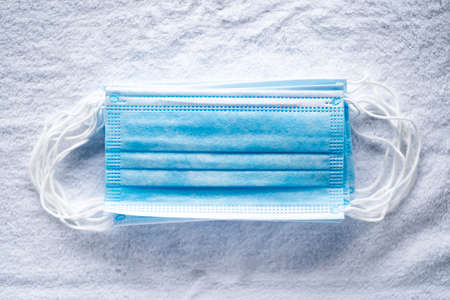 medical surgical face mask. mouth protection on white towel backgroundの写真素材