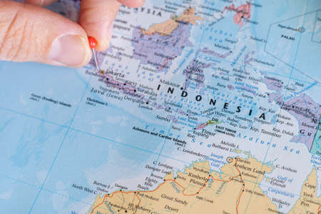 Indonesia pin on a world map. Indonesia travel destination planning pinnedのeditorial素材