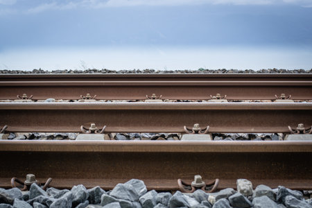 Railway tracks and cloudy sky with copy space for text or imageの写真素材