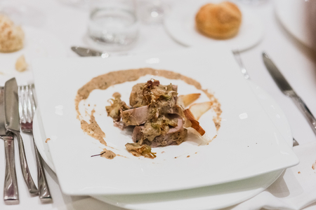 Main dish cooked with meat and garnishの写真素材