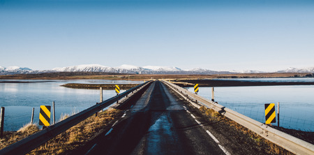 Icelandic lonely road in wild territory with no one in sightの写真素材
