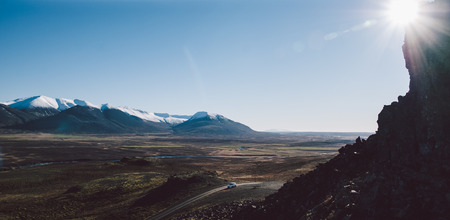Icelandic landscapes full of green grass, sea and blue sky.の写真素材