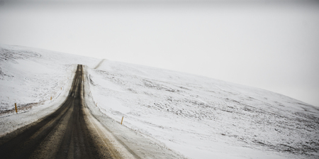 Road trip secondary with snow without anyone driving through Icelandの写真素材