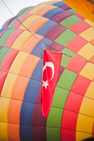 Colorful balloons flying over mountains and with blue skyの写真素材