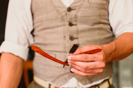 Barber preparing to shave a client.の写真素材