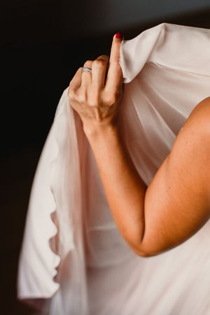 Detail of a white and elegant wedding dress.の写真素材