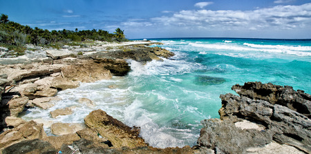 Ocean breaking waves on tropical rocky coast