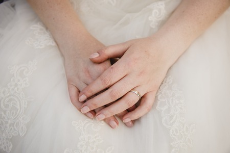 Detail of a white and elegant wedding dress.の写真素材