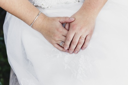 Detail of a white and elegant wedding dress.の写真素材