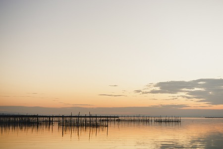 Blue lake among tranquil woods to relax with calm on vacationの写真素材