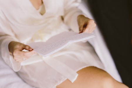 Detail of a white and elegant wedding dress.の写真素材
