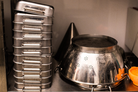 All steel industrial kitchen with burners and utensilsの写真素材