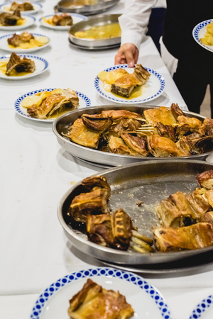 Waiters serving meat dishes at an eventの写真素材