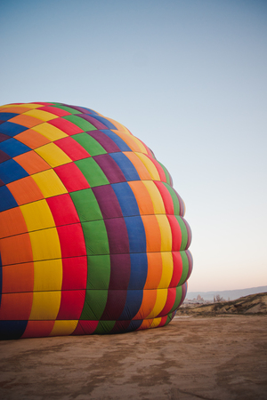 Colorful balloons flying over mountains and with blue skyの写真素材