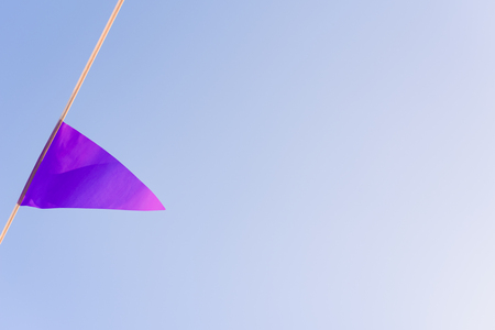 colorful garlands waving in the wind against a blue sky ideal for decorating a birthday.の写真素材