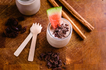 Fruit smoothie with chocolate chips, cinnamon, watermelon and fruitsの写真素材