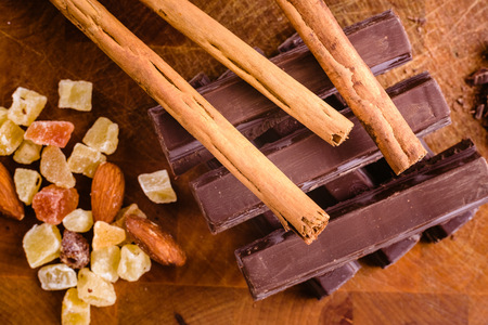 Plate of black chocolate chips with cinnamon and hazelnutsの写真素材