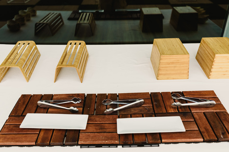 Empty wooden cutlery and wooden dishes ready for an event