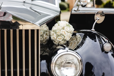 Bridal bouquet held by her with her hands at her weddingの写真素材