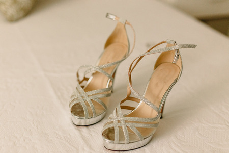 Wedding shoes on their wedding isolated in a roomの写真素材