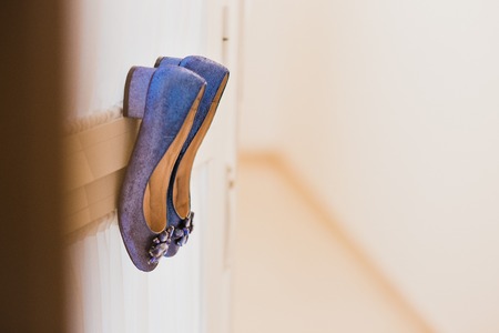 Wedding shoes on their wedding isolated in a roomの写真素材