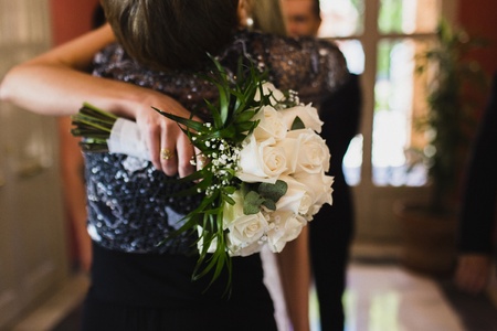 Bridal bouquet held by her with her hands at her weddingの写真素材