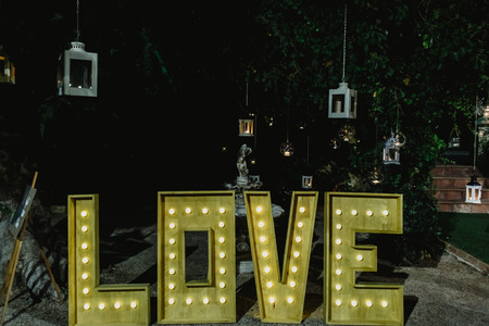 Giant lettering poster with the word love at night for weddingsの写真素材