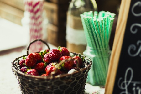 Basket with strawberries ready to make natural juice with themの写真素材