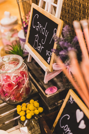 candy bar at a wedding filled with sweets and baublesの写真素材