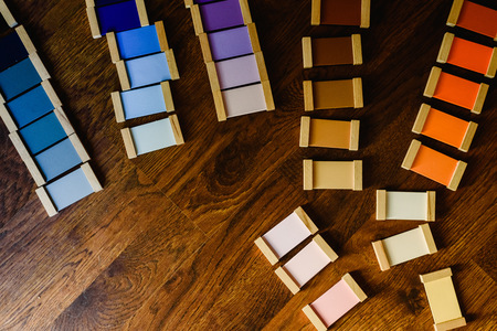 Montessori color tablets on wooden floor backgroundの写真素材