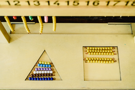 Hanger for color bead stairs, counting  in a montessori classroom