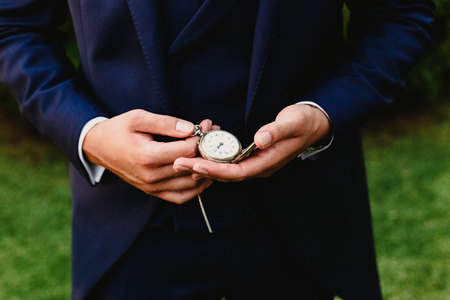 Groom with pocket watchの写真素材