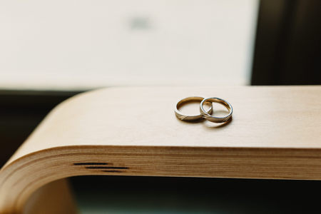 Single gold and silver wedding ringsの写真素材